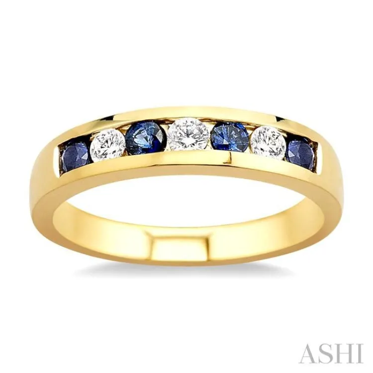 1/5 Ctw Channel Set Round Cut Diamond and 2.5 MM Round Cut Sapphire Band in 14K Yellow Gold